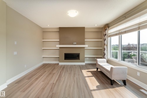 3301 Abbott Crescent Sw, Edmonton, AB - Indoor Photo Showing Living Room With Fireplace