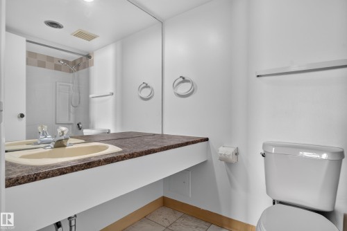 Wall-mounted vanity with an integrated sink and an expansive countertop - #301 9809 110 St Nw, Edmonton, AB 