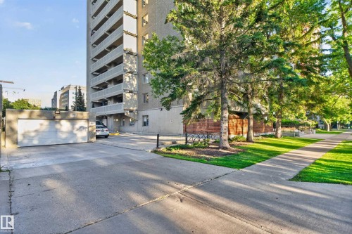 Multi-level concrete residential building with private balconies and a ground-level garage - #301 9809 110 St Nw, Edmonton, AB 