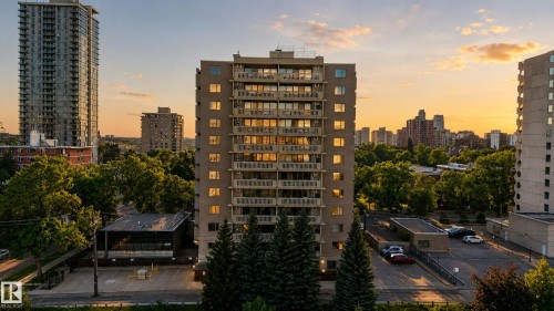 Multi-story building featuring numerous balconies and a visible parking area - #301 9809 110 St Nw, Edmonton, AB 