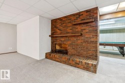 Rumpus room on 4th level. Wood burning fireplace for cozy winter days. - 