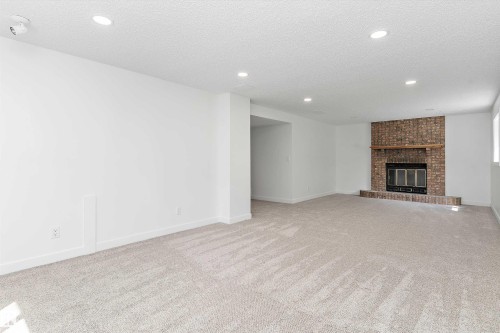 8311 184 Street Nw, Edmonton, AB - Indoor Photo Showing Other Room With Fireplace
