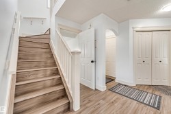 Wood-finish flooring throughout the entryway - 