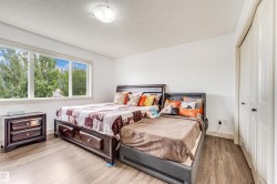 White walls with a light wood-finish flooring - 