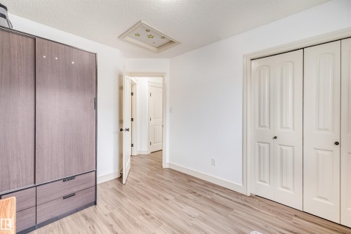 Wood-finish flooring, white walls, and a recessed ceiling feature - 20324 48 Avenue Nw, Edmonton, AB 