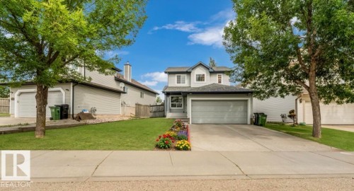 Two-story residence with a front-facing attached garage and a concrete driveway - 20324 48 Avenue Nw, Edmonton, AB 