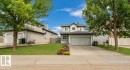 Two-story residence with a front-facing attached garage and a concrete driveway - 20324 48 Avenue Nw, Edmonton, AB 