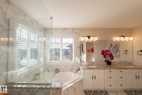 White shaker-style vanity with dual sinks and granite countertops - 914 Crystallina Nera Way Nw, Edmonton, AB 