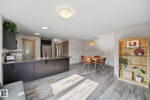 Open-concept living space featuring ceiling-mounted lighting fixtures - 17621 10 Avenue Sw, Edmonton, AB - Indoor