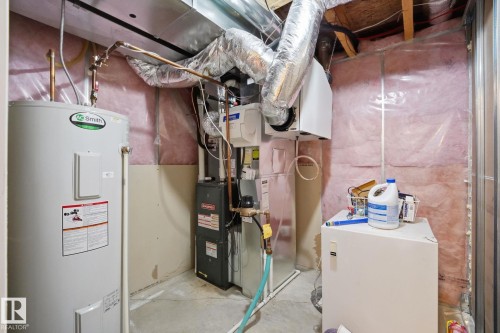 Water heater, furnace, and exposed ductwork - 17621 10 Avenue Sw, Edmonton, AB - Indoor Photo Showing Basement