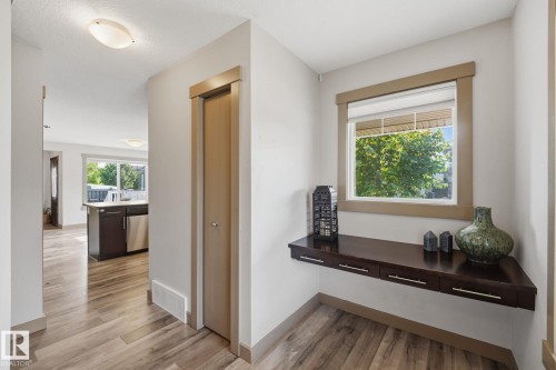 Entryway featuring a built-in floating console table with drawers, and a window - 17621 10 Avenue Sw, Edmonton, AB - Indoor Photo Showing Other Room