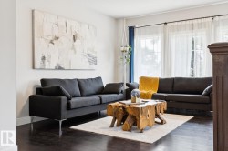 Dark wood-finish flooring complements light-toned walls - 