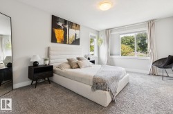 Recessed lighting, light gray wall paint, large windows, and carpet flooring - 
