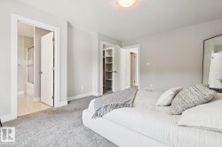 Plush carpeting, light-colored wall paint, recessed lighting, and built-in closet shelving - 