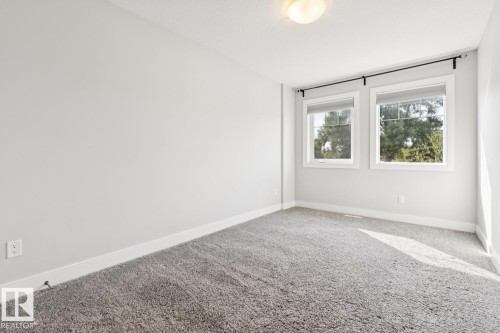 Light gray carpeting with white baseboards - 9919 79 Street Nw, Edmonton, AB 