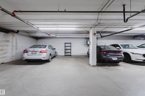 Concrete flooring and walls with overhead lighting, exposed ceiling pipes, and structural columns - #7428 7327 South Terwillegar Dr Nw, Edmonton, AB 