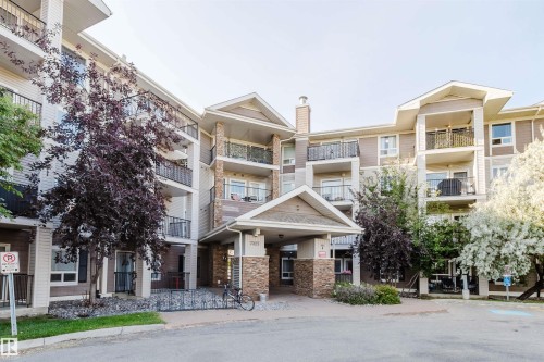 Multi-story exterior with balconies featuring metal railings - #7428 7327 South Terwillegar Dr Nw, Edmonton, AB 