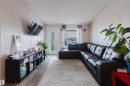Wood-finish flooring with a neutral wall color, providing a versatile backdrop - #7428 7327 South Terwillegar Dr Nw, Edmonton, AB 