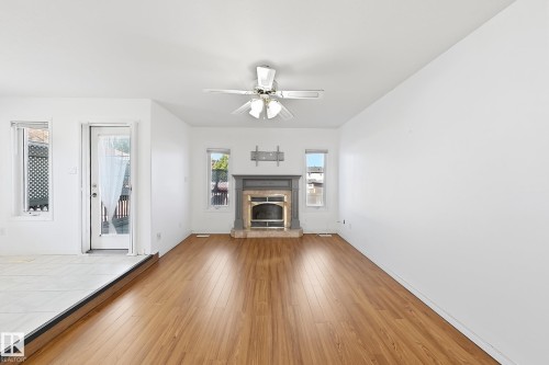 Wood-finish flooring, white walls, and a ceiling fan - 3015 37 Street Nw, Edmonton, AB 