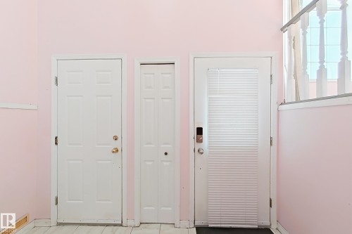White paneled doors with brass hardware - 3015 37 Street Nw, Edmonton, AB 