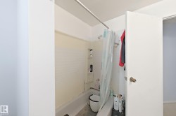 Tub/shower combination with built-in shelving and a shower curtain rod - 