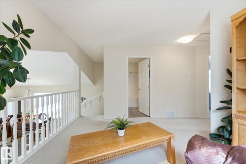 Vaulted ceiling with a white painted railing and staircase - 1709 Turvey Bend Bend Nw, Edmonton, AB 