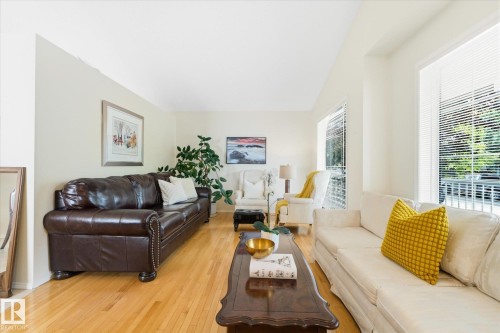 Hardwood flooring, light neutral wall color, recessed lighting, and multiple windows with blinds - 1709 Turvey Bend Bend Nw, Edmonton, AB 