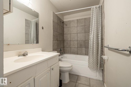 White vanity with integrated sink - 54 Lakewood Village Nw, Edmonton, AB 