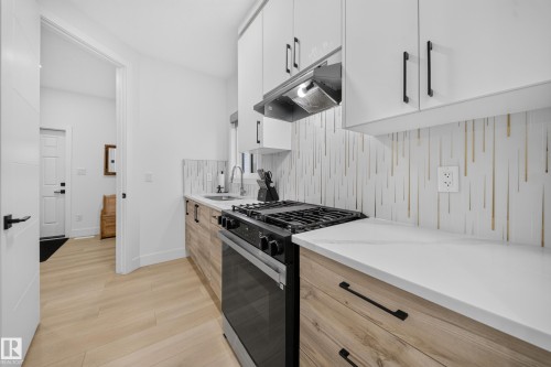 Walk-Thru Spice Kitchen, with access from the garage, mud-room and main kitchen. - 17128 2 Street Nw, Edmonton, AB 