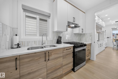 Walk-Thru Spice Kitchen, with access from the garage, mud-room and main kitchen. - 17128 2 Street Nw, Edmonton, AB 