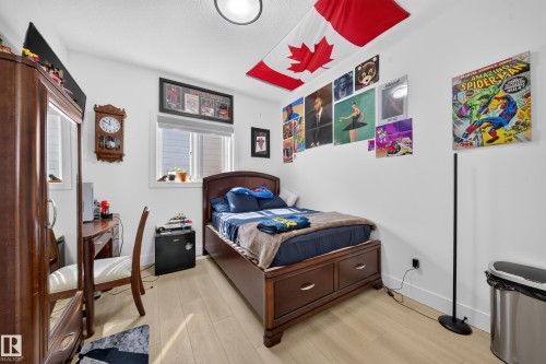 White walls with light wood-finish flooring - 17128 2 Street Nw, Edmonton, AB 