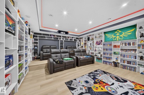 Built-in shelving, recessed lighting, wood-finish flooring, two tiers of seating. - 17128 2 Street Nw, Edmonton, AB 