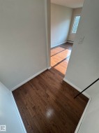 Hardwood flooring extending throughout the space - 