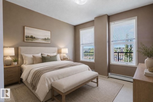 Neutral-toned walls complement the light-colored flooring - #1-405 4245 139 Av Nw, Edmonton, AB 