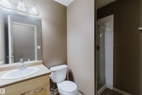 Vanity with integrated sink, chrome faucet, and under-vanity storage - #1-405 4245 139 Av Nw, Edmonton, AB 