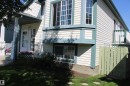 Bi Level with horizontal siding, bay window, covered porch entry, and a side balcony with railing - 15031 135 Street Nw, Edmonton, AB 