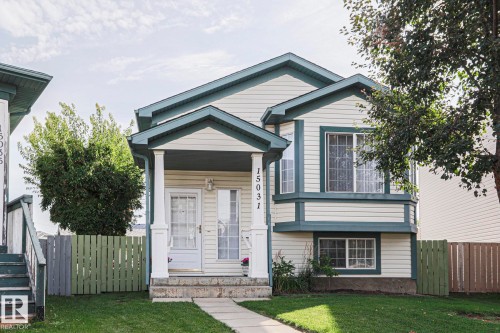Two-story residence featuring light-colored siding and dark trim - 15031 135 Street Nw, Edmonton, AB 