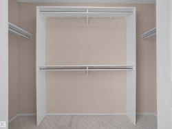 Built-in shelving with two hanging rods and upper storage - 