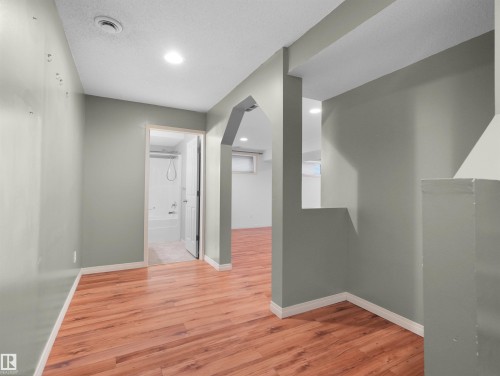 Wood-finish flooring throughout - 2410 32B Street Nw, Edmonton, AB 