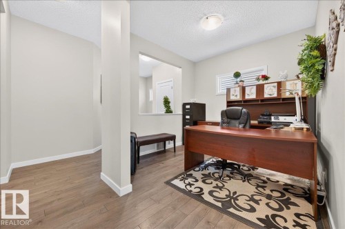 Dedicated room featuring wood-finish flooring and neutral wall tones - 2709 Collins Crescent Sw Sw, Edmonton, AB - Indoor Photo Showing Office