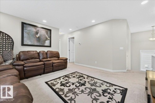 Spacious room featuring neutral carpeting and light gray walls - 2709 Collins Crescent Sw Sw, Edmonton, AB - Indoor Photo Showing Other Room