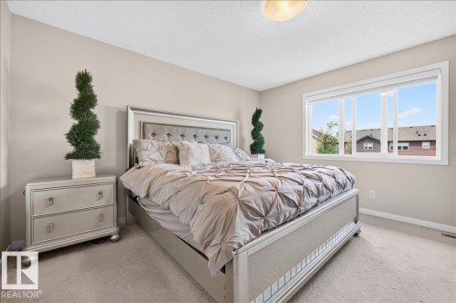 Spacious room featuring neutral-toned walls and carpeted flooring - 2709 Collins Crescent Sw Sw, Edmonton, AB - Indoor Photo Showing Bedroom