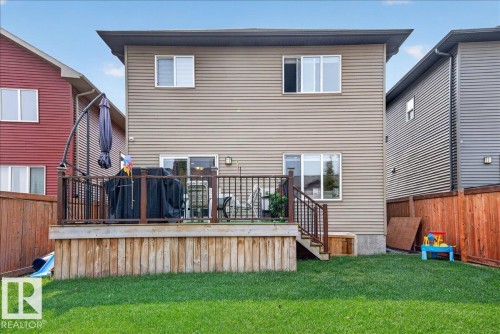 Rear exterior with a two-story design and horizontal siding - 2709 Collins Crescent Sw Sw, Edmonton, AB - Outdoor With Deck Patio Veranda With Exterior