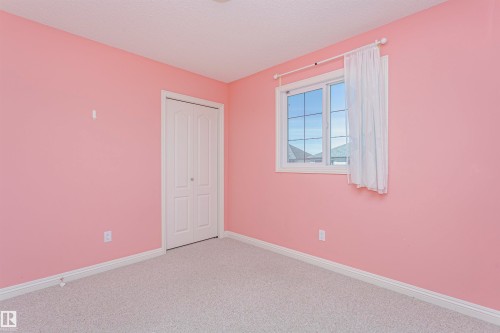 Wall-to-wall carpeting and white trim throughout - 2407 Hagen Way Nw, Edmonton, AB 