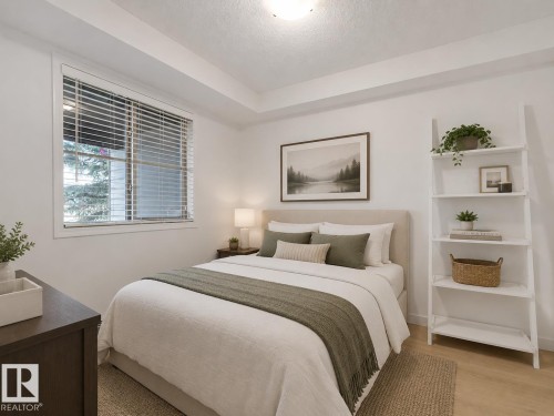 Recessed lighting, window with blinds, wood-finish flooring, built-in shelving, and a neutral color palette - #114 12035 22 Av Sw, Edmonton, AB 