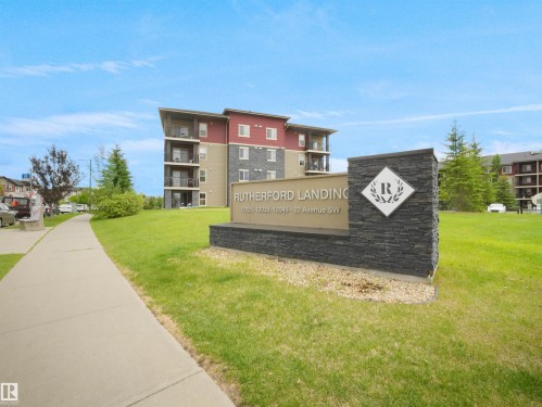 Modern multi-story building with a flat roofline and private balconies - #114 12035 22 Av Sw, Edmonton, AB 