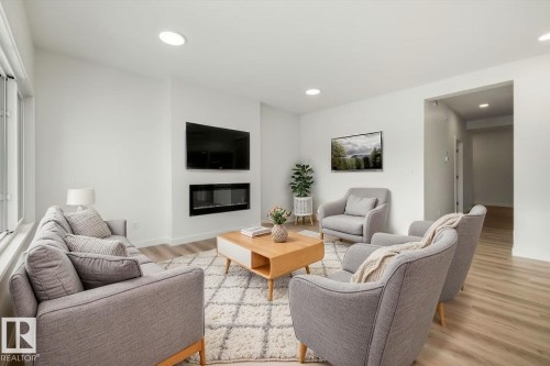 1315 11 Avenue Nw, Edmonton, AB - Indoor Photo Showing Living Room With Fireplace
