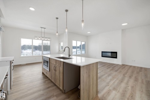 1315 11 Avenue Nw, Edmonton, AB - Indoor Photo Showing Kitchen With Fireplace With Upgraded Kitchen