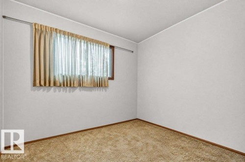 Light-colored walls with brown trim detail - 12705 87 Street Nw, Edmonton, AB 