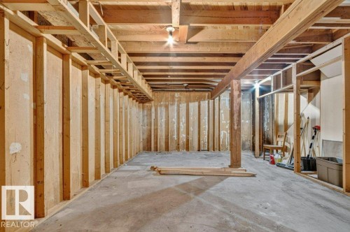 Framed interior space with exposed ceiling joists and concrete flooring - 12705 87 Street Nw, Edmonton, AB 